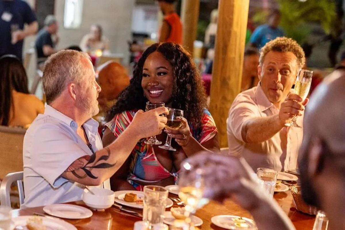 a group of people sitting at a table drinking wine