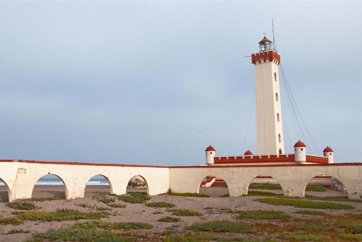 a lighthouse sitting on top of a bridge