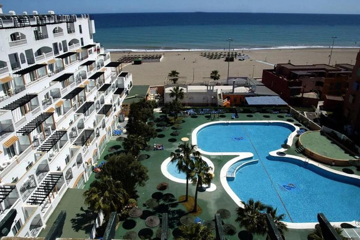 a view of a resort with a swimming pool and the beach