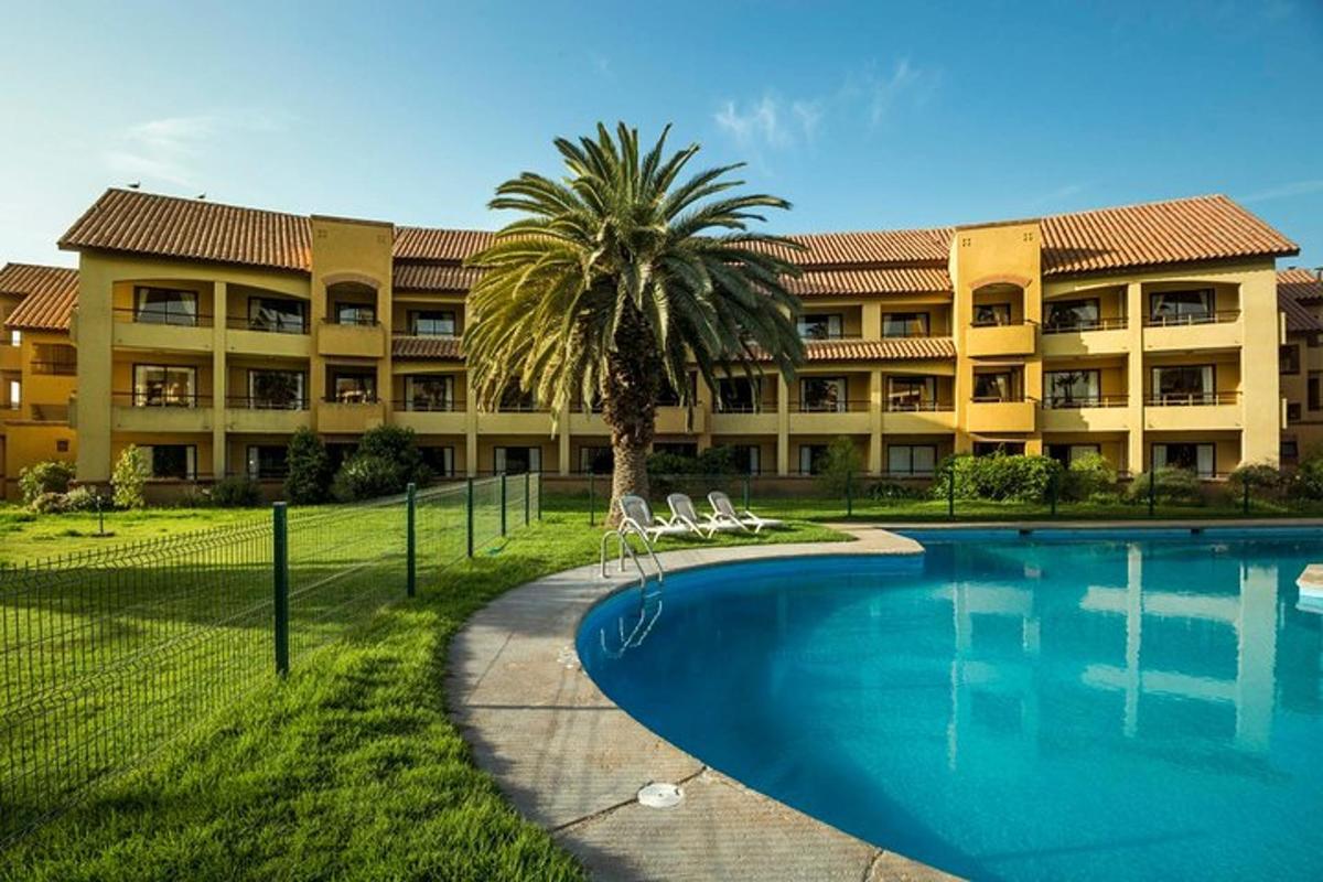 a resort with a swimming pool in front of a building