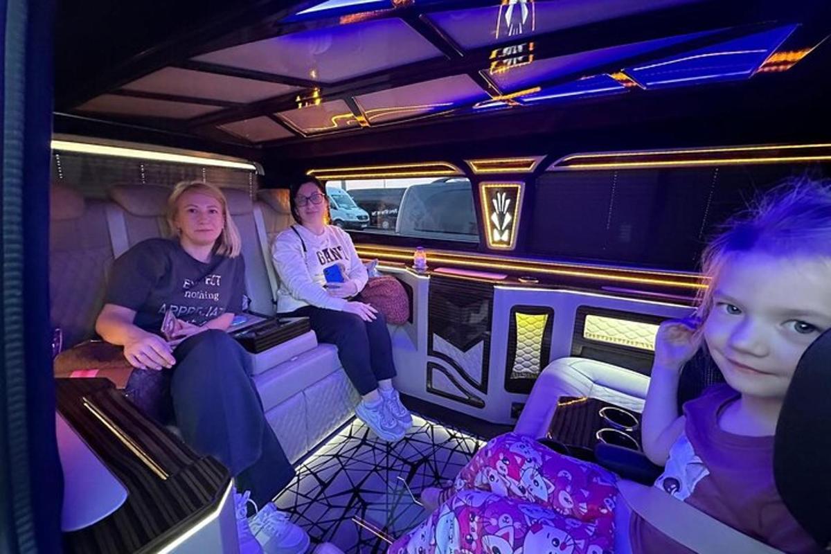 a group of people sitting in the back of a van