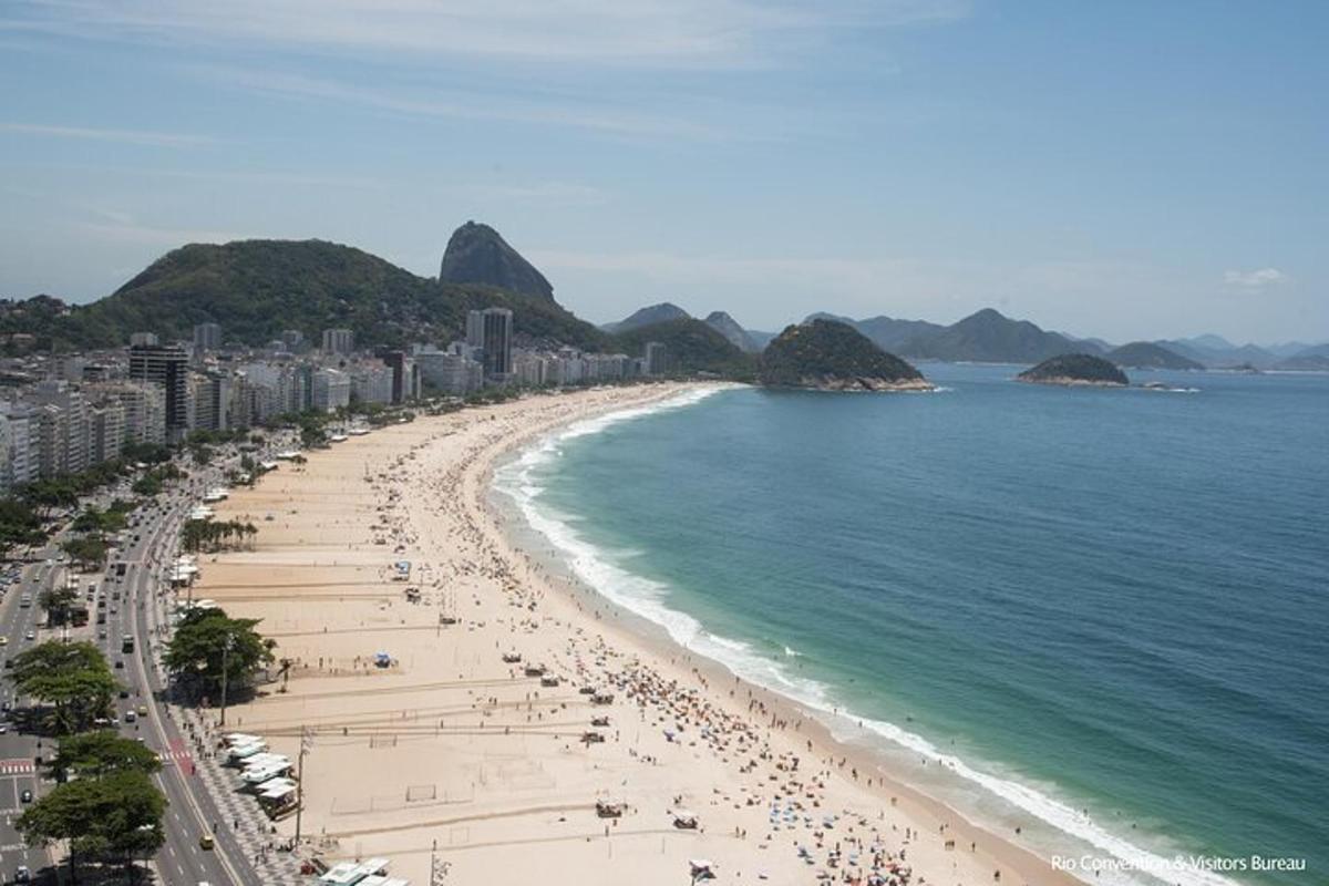 a beach with a lot of people and the ocean