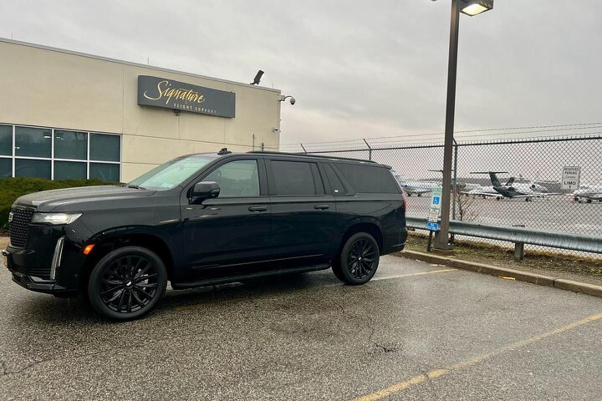 a black suv parked in a parking lot