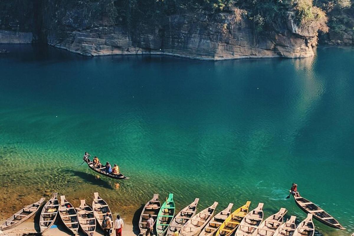 a group of boats in the water with people in them