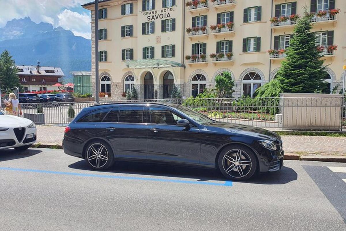 a black car parked in front of a building