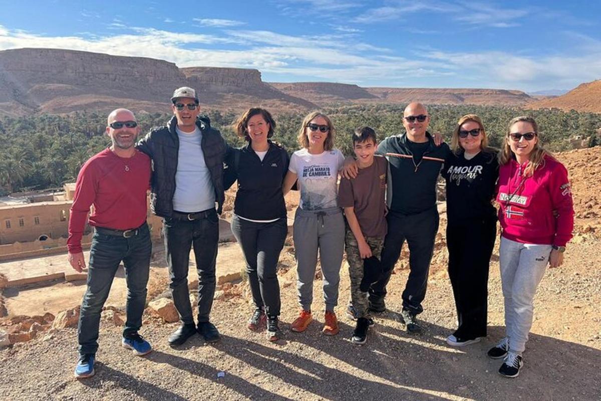 a group of people standing on top of a mountain