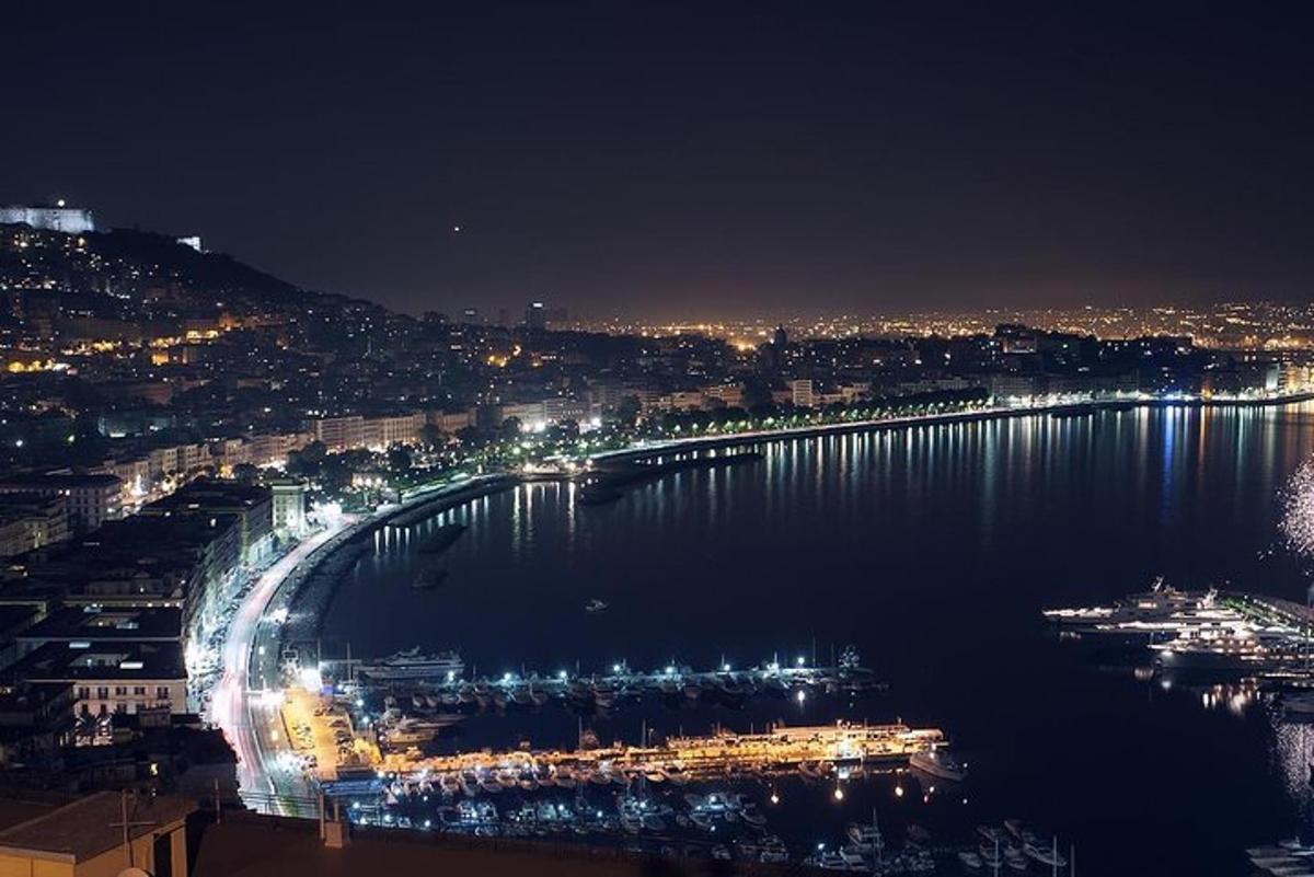 a view of a bridge over a river at night