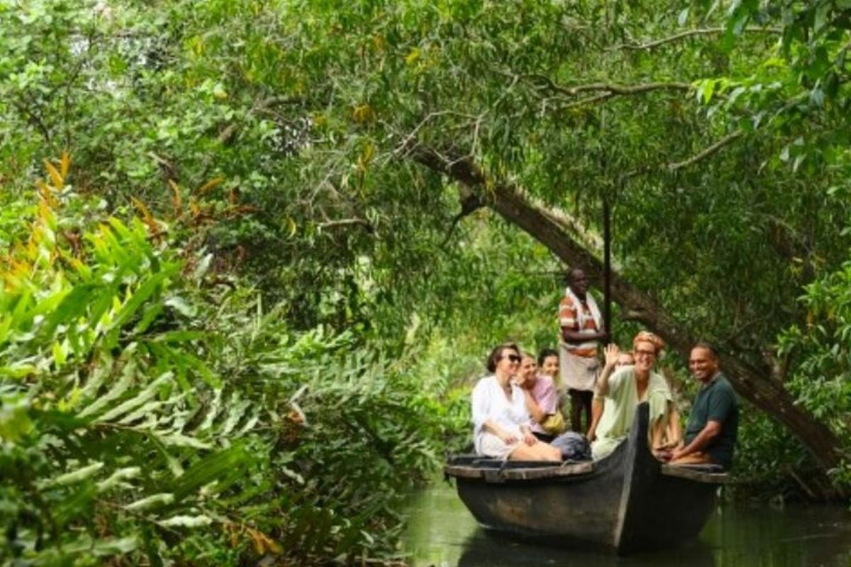 a group of people sitting on a boat in the water