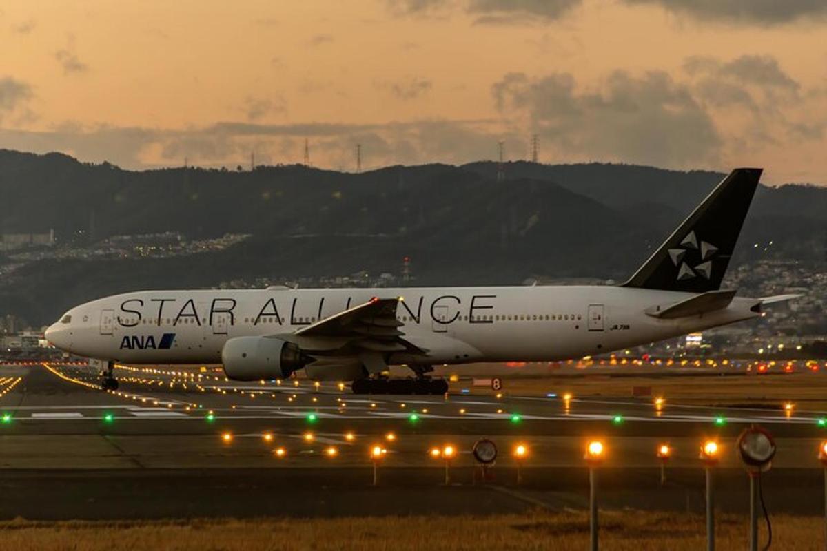 a star alliance airplane on the runway at an airport