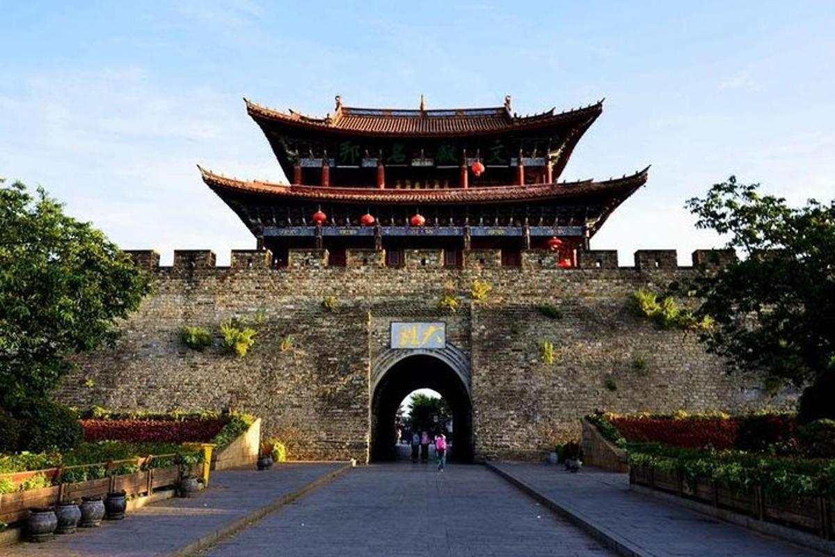 a large building with a gate in a wall