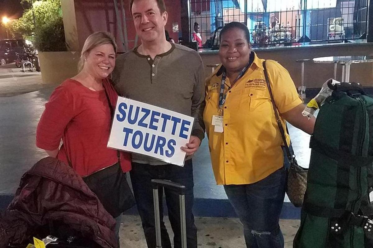 a man and two women holding a sign that reads visible tours