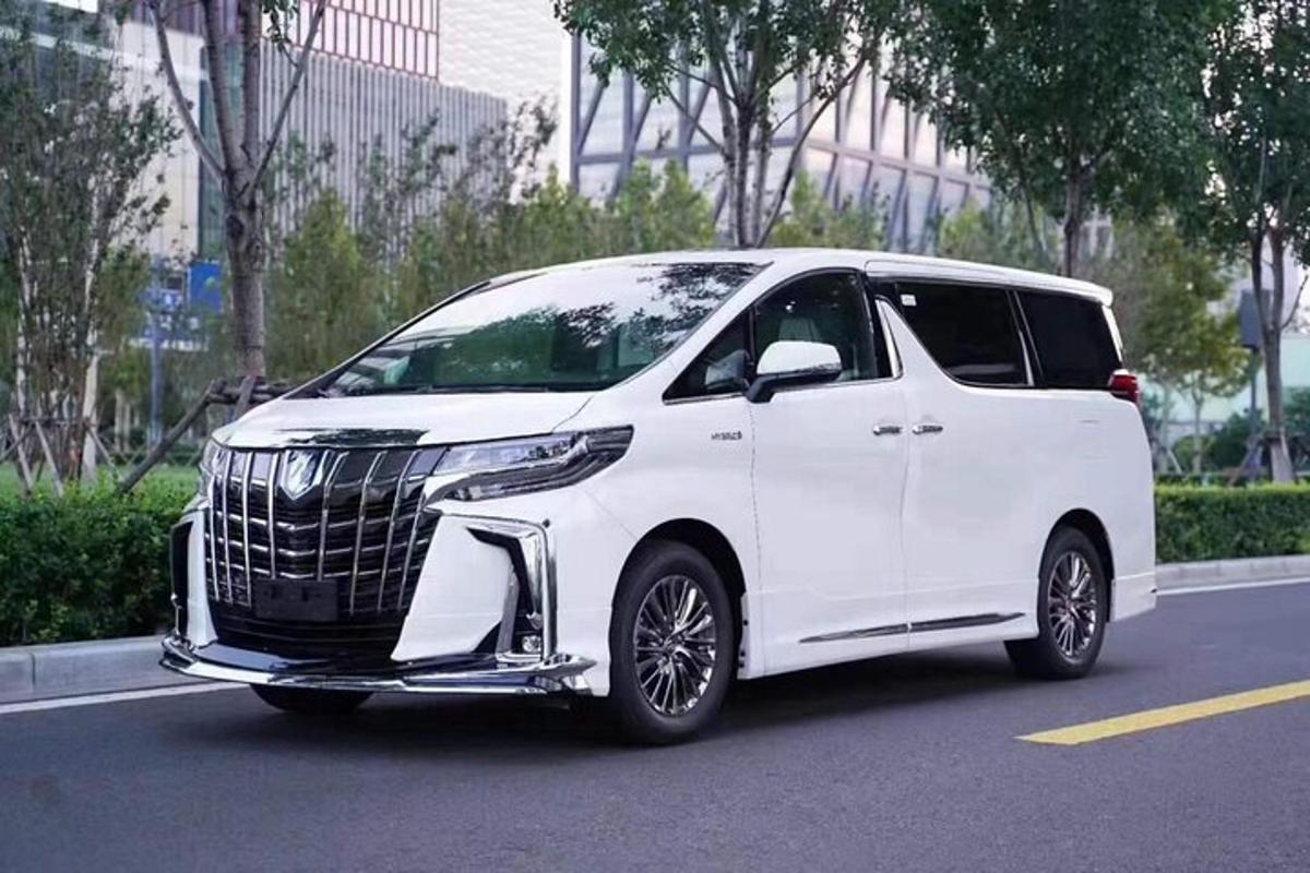 a white van is parked in a parking lot