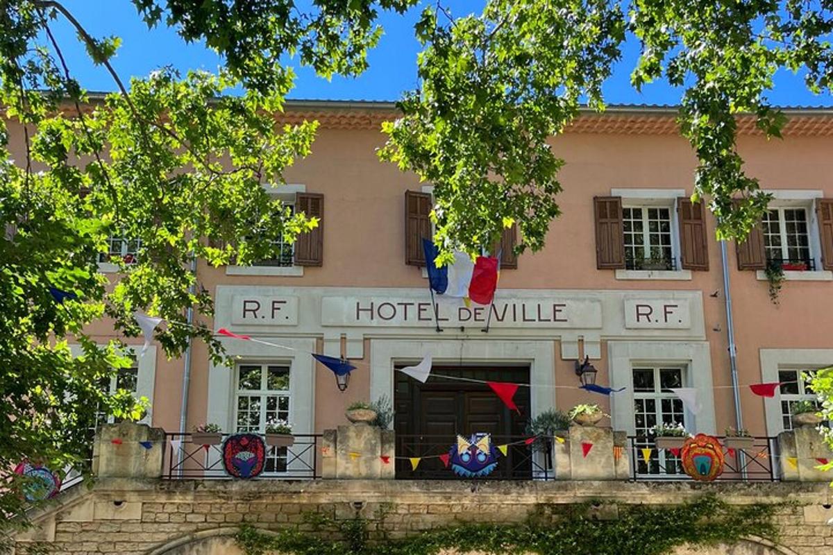 a hotel building with flags in front of it