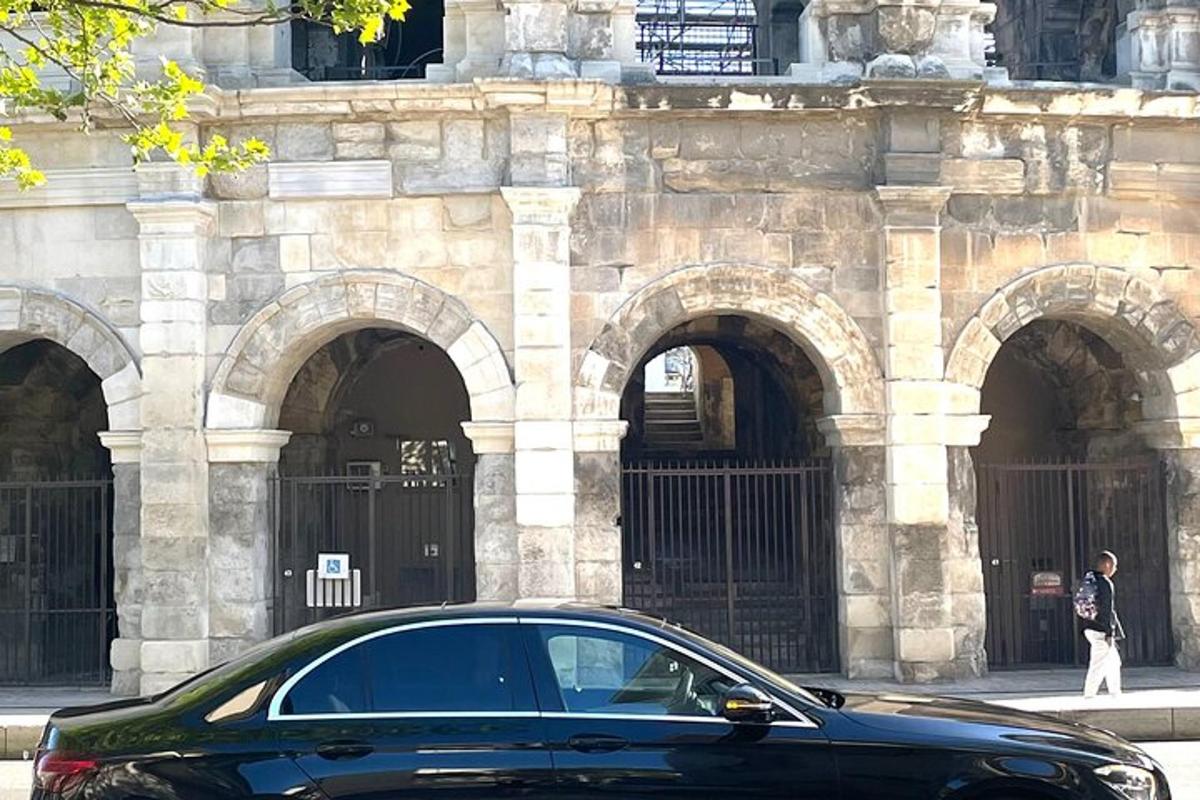 a black car parked in front of a building