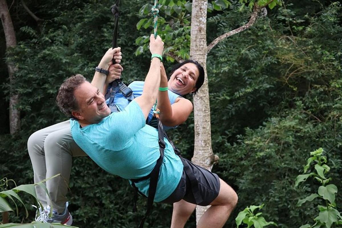 a man and a woman on a zip line