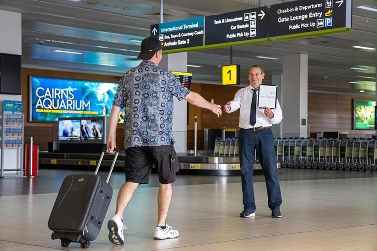 two men shaking hands in an airport terminal