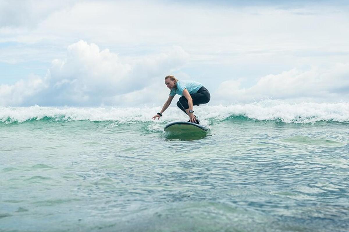 a man riding a wave on a surfboard in the ocean