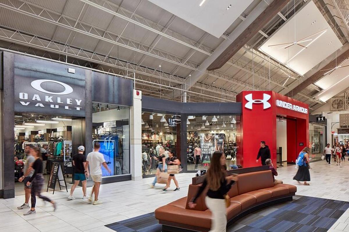 a group of people walking in a shopping mall