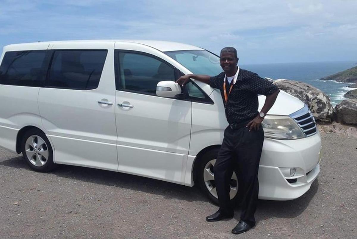 a man is standing next to a white van
