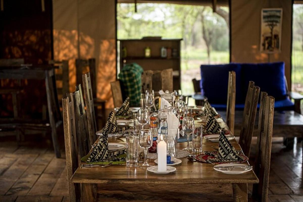a wooden table with plates and glasses on it