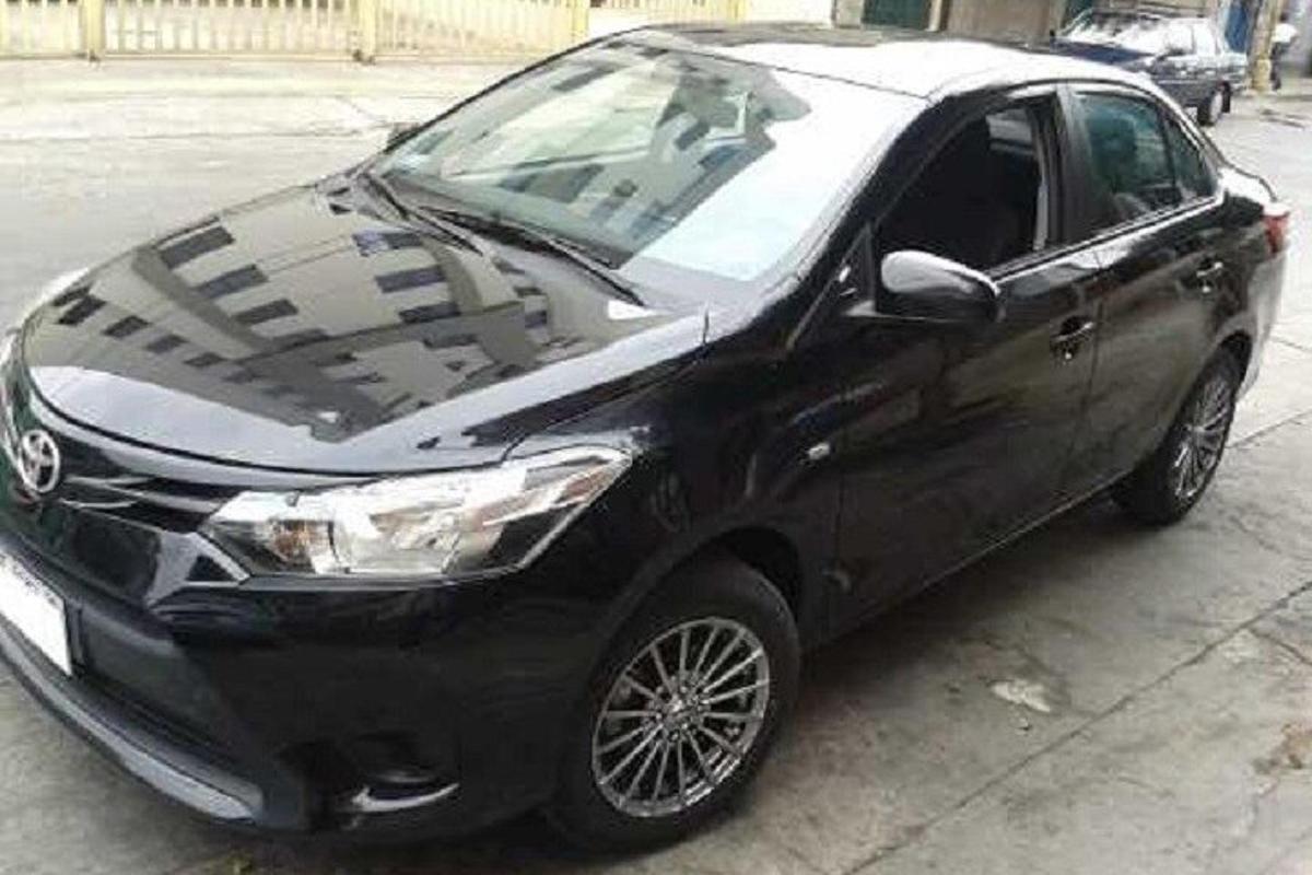 a black car parked in a parking lot
