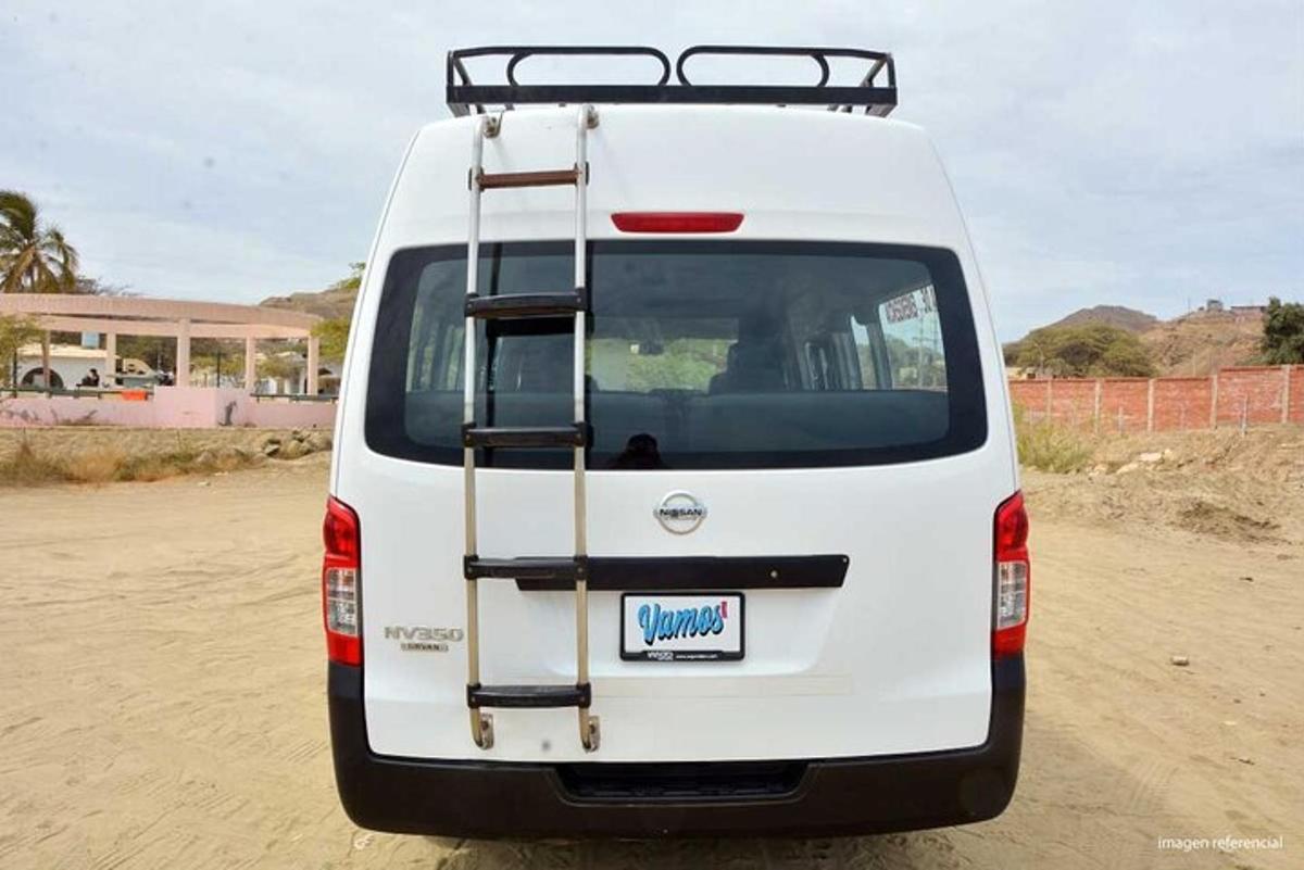 a white van parked on a dirt road