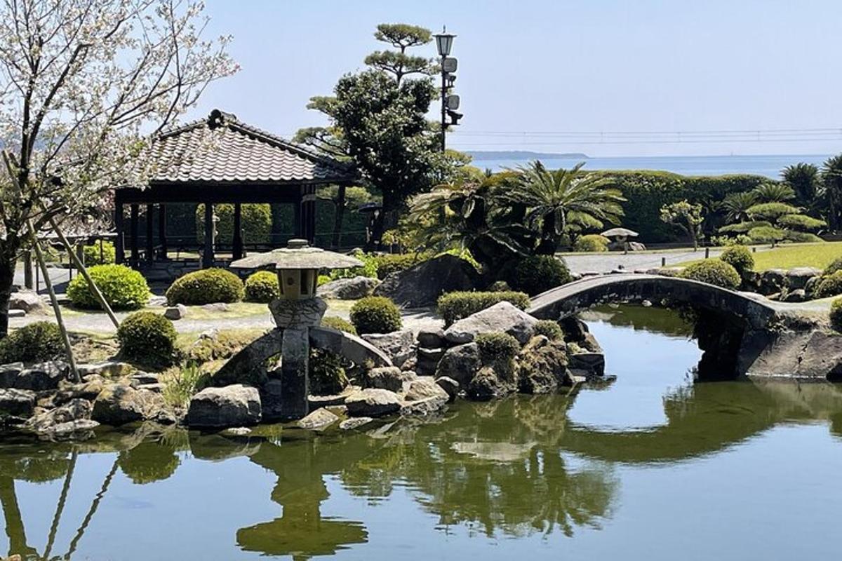 a bridge over a pond in a garden