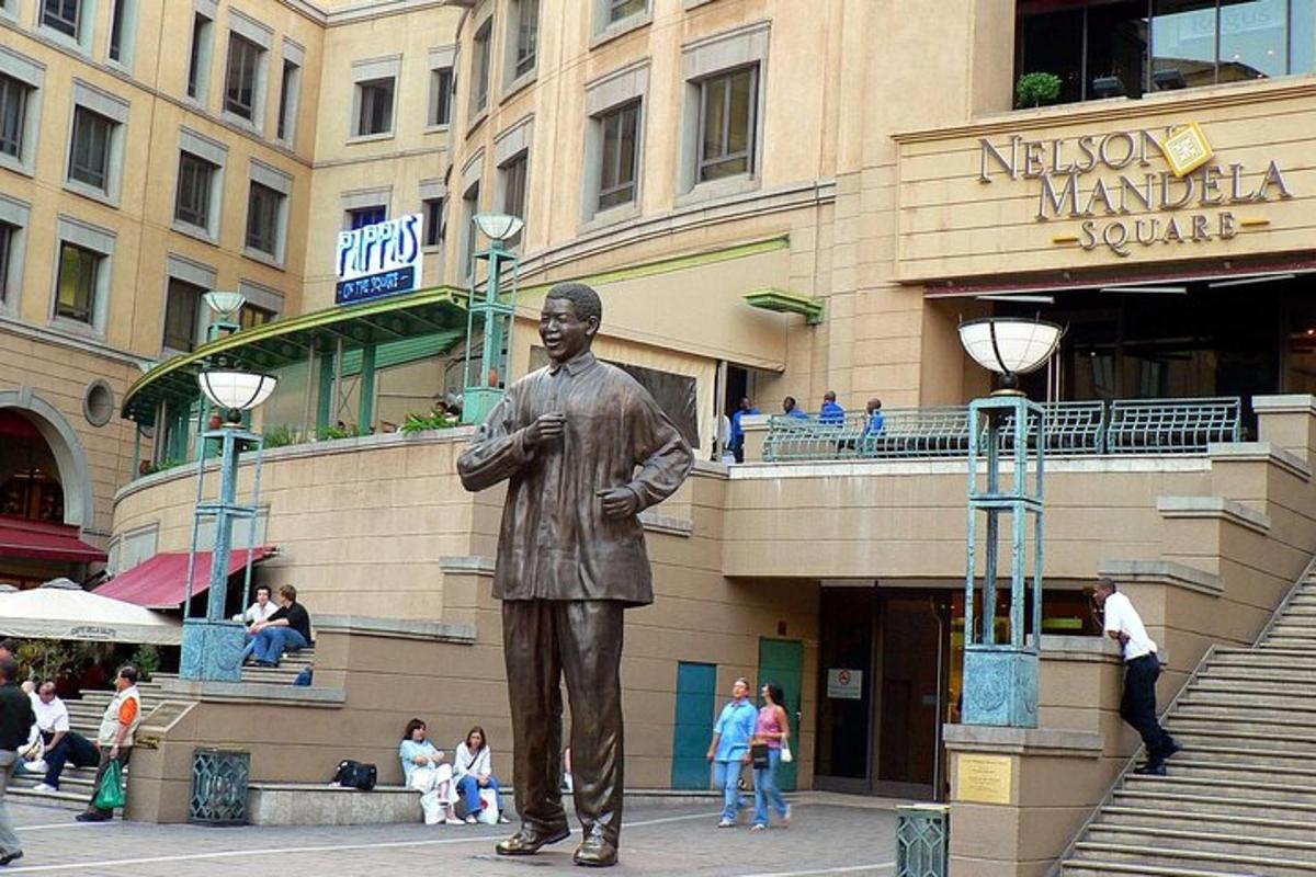 a statue of a man in front of a building