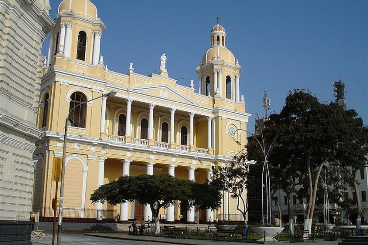 a large yellow building with a clock tower