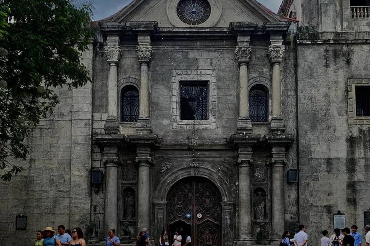 a group of people standing outside of an old building