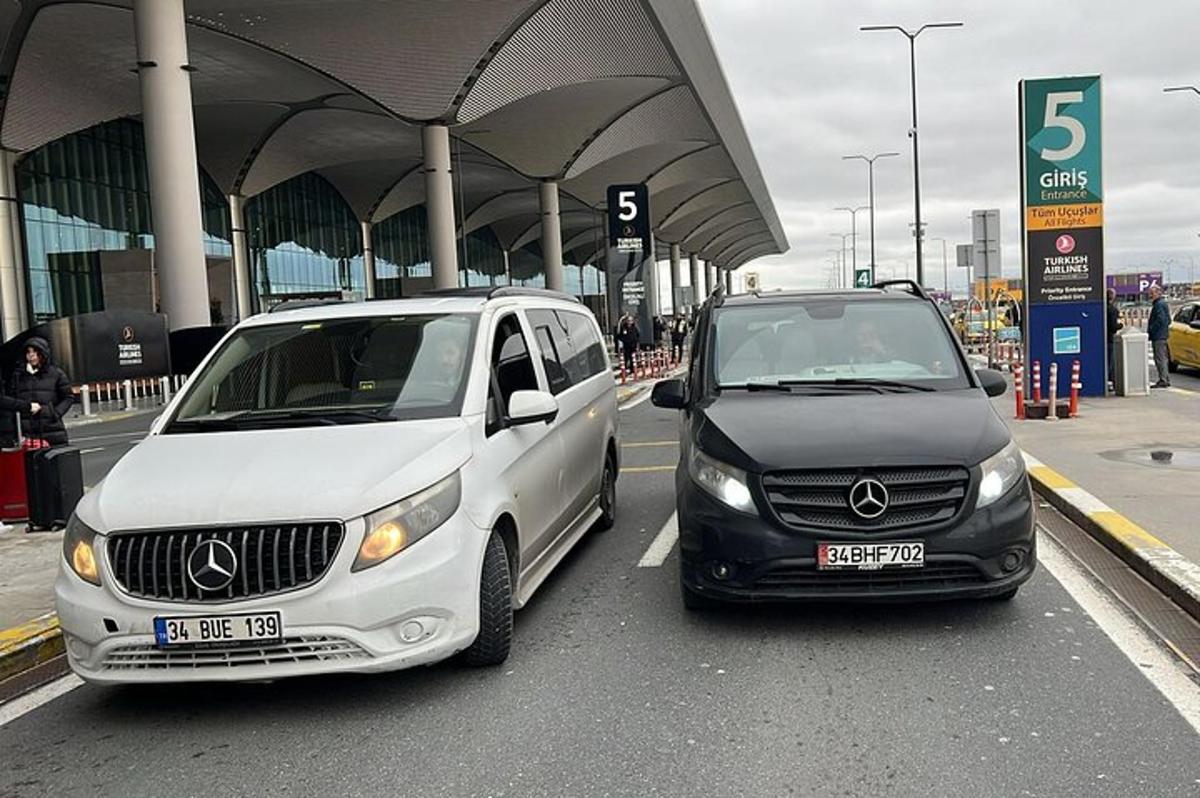 two cars parked next to each other on a street