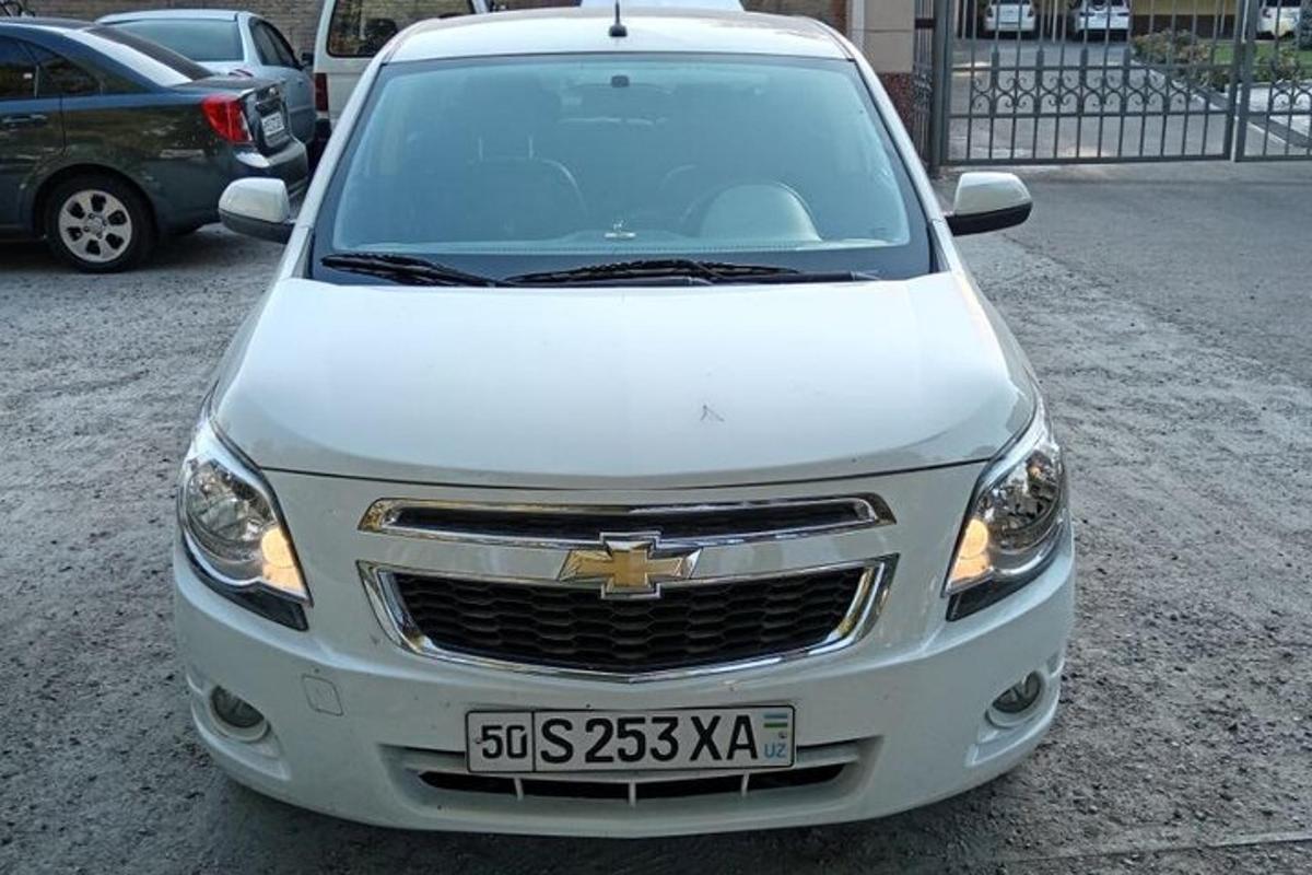 a white car parked in a parking lot