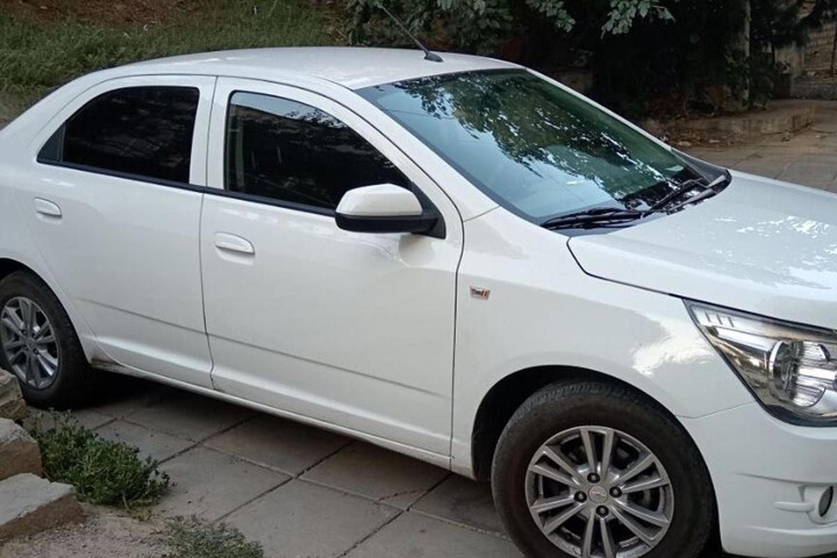 a white car parked in a driveway