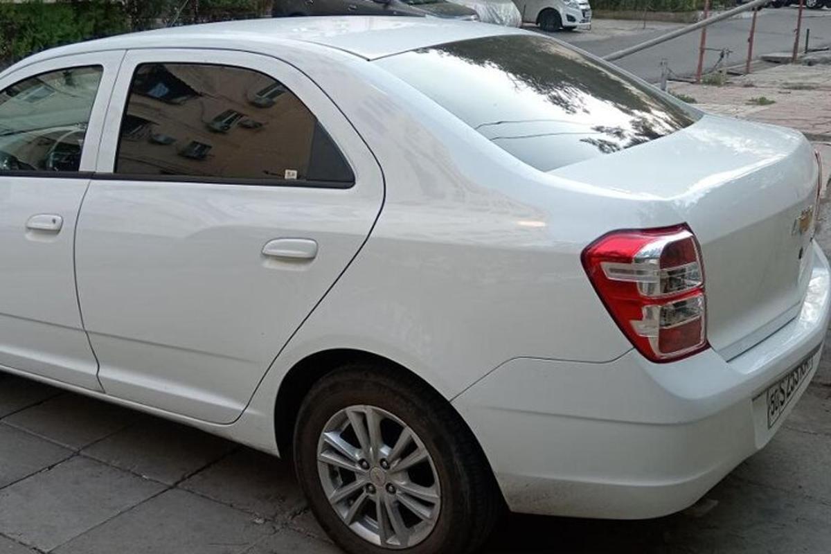 a white car parked in a parking lot
