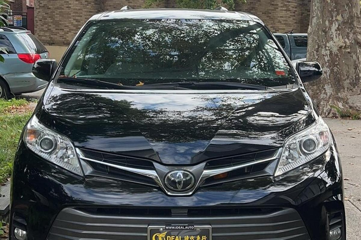 a black car parked in a parking lot