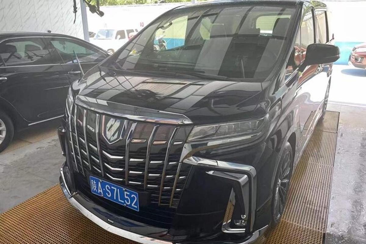 a black car parked in a parking lot