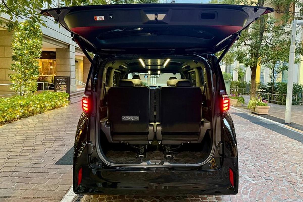 a car with its trunk open on a street