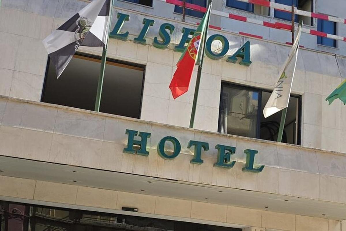 a hotel with flags on top of a building