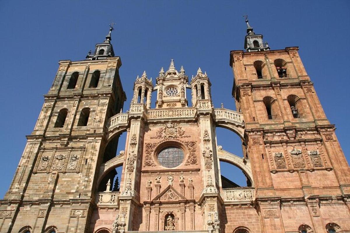a tall building with two towers with a clock on it