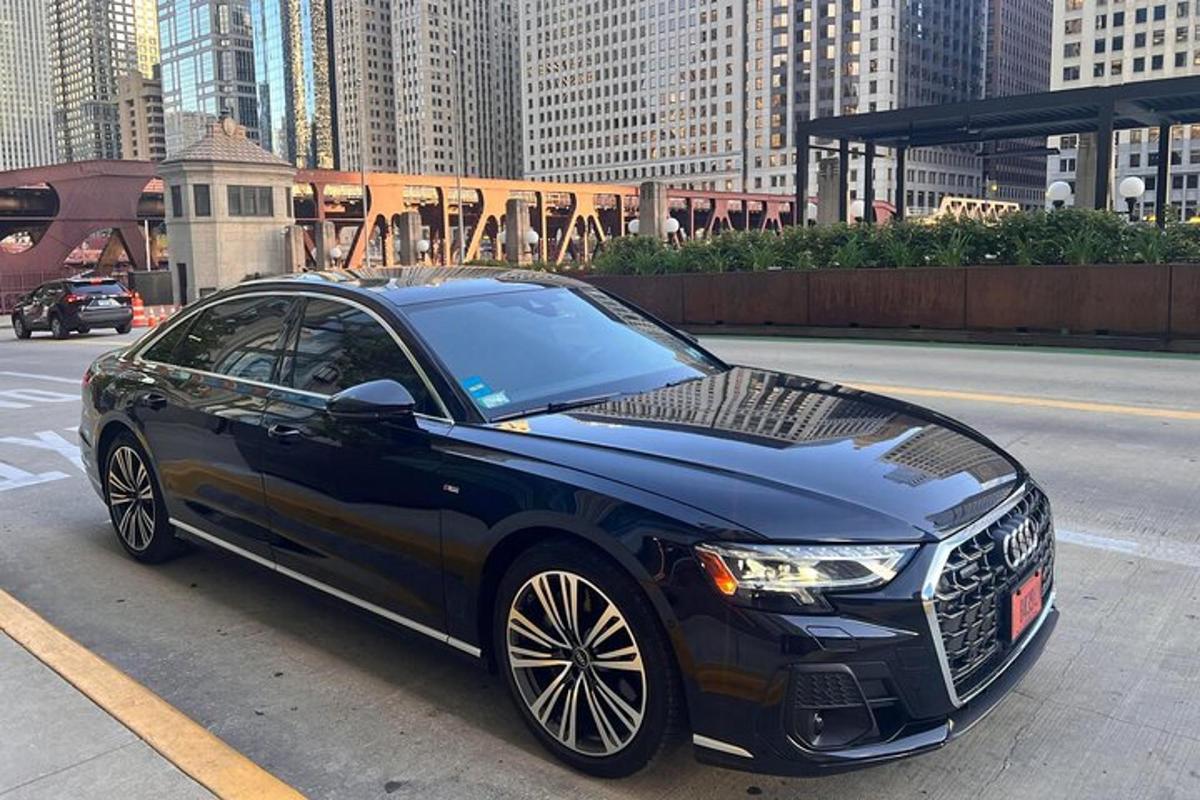 a black car parked on a city street