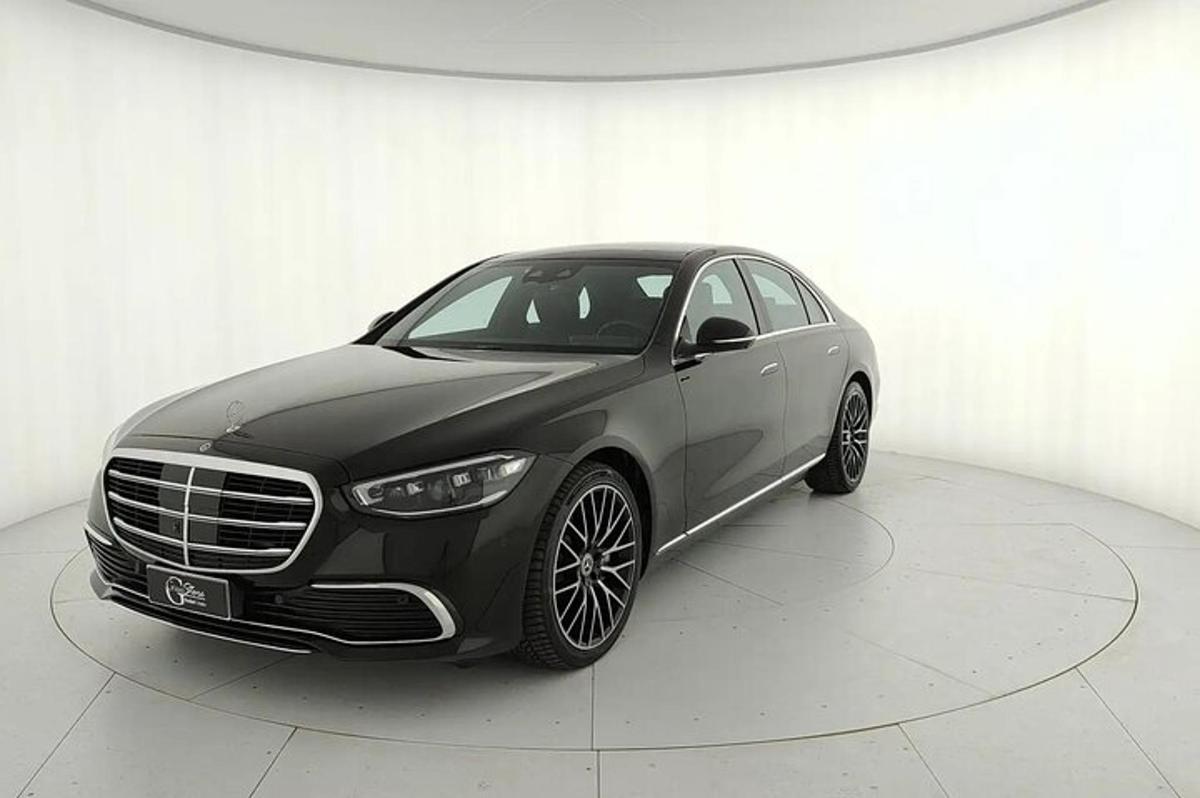 a black car parked in a white room