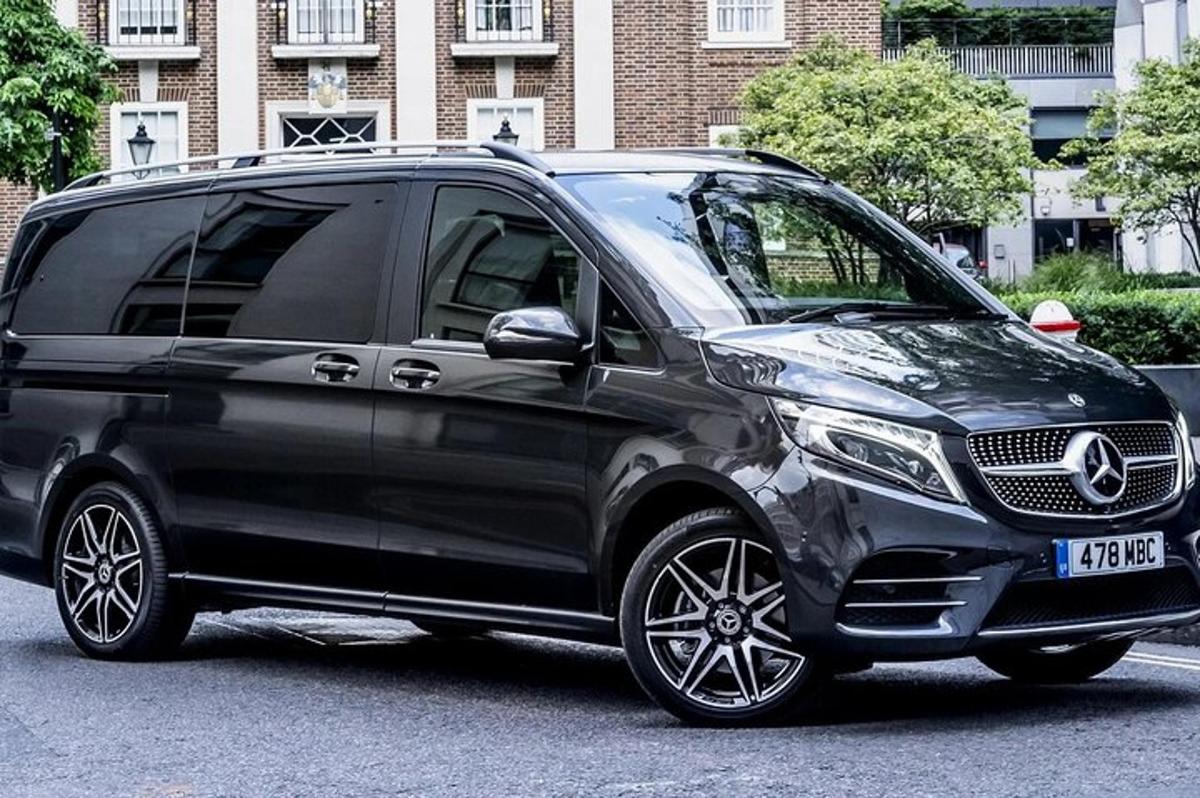 a black mercedes benz van parked in a parking lot