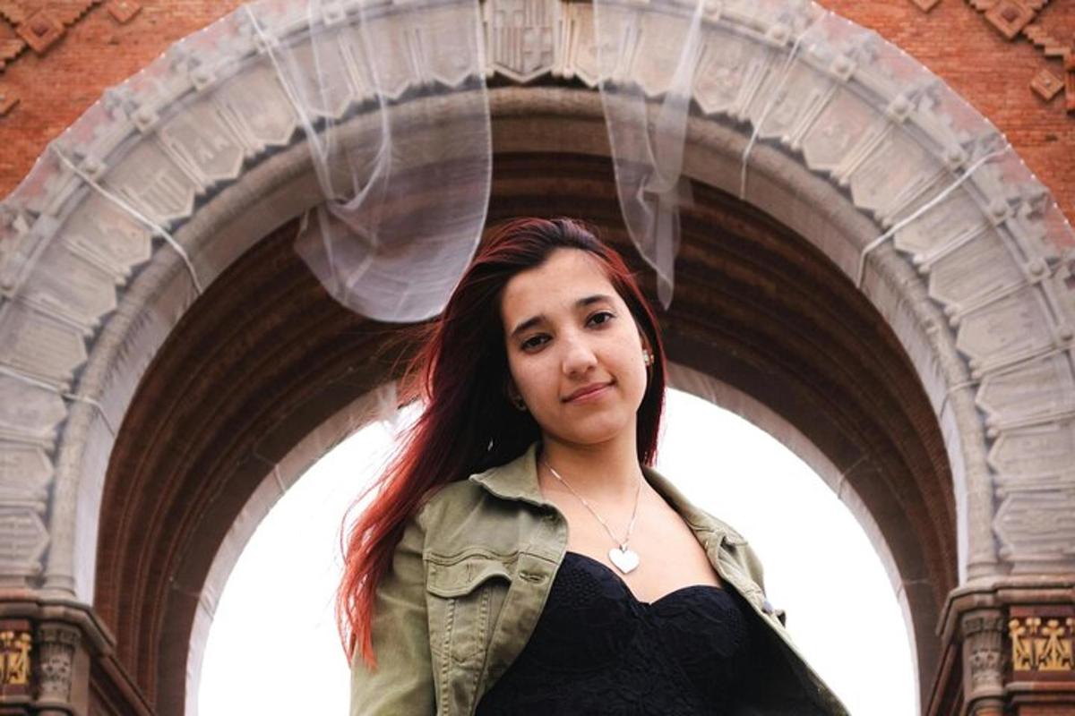 a woman is standing in an archway