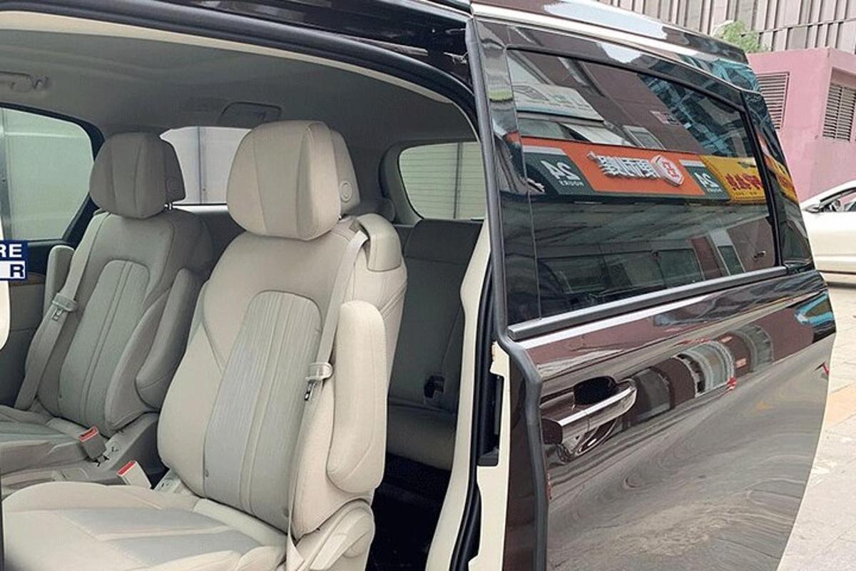 a van with its doors open with the back seats open