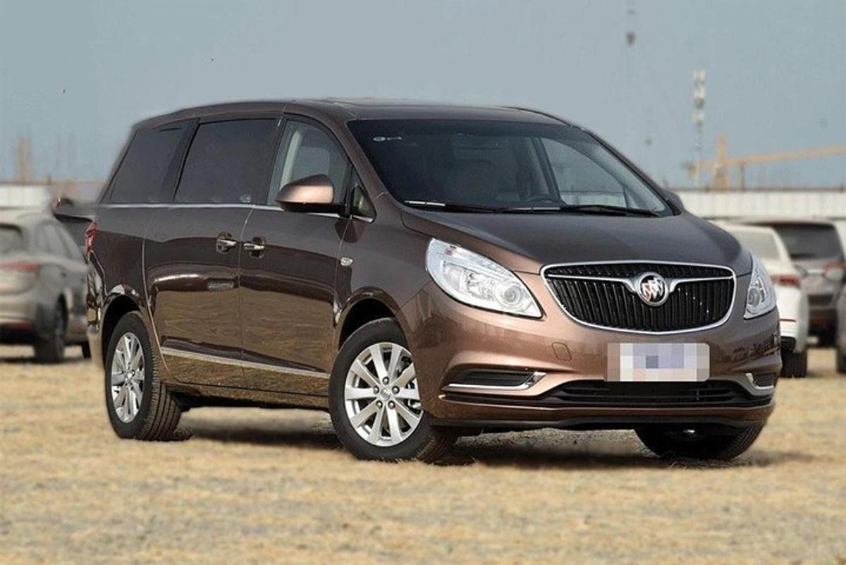 a brown suv parked in a field