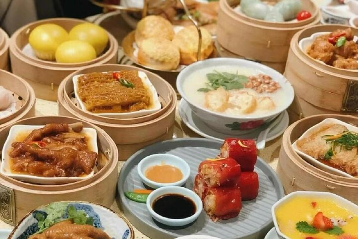 a table filled with plates of food and bowls of food