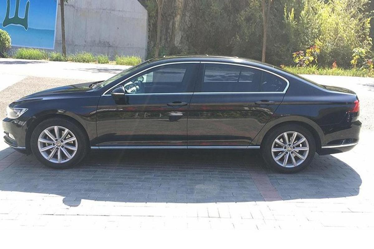 a black car parked in a parking lot