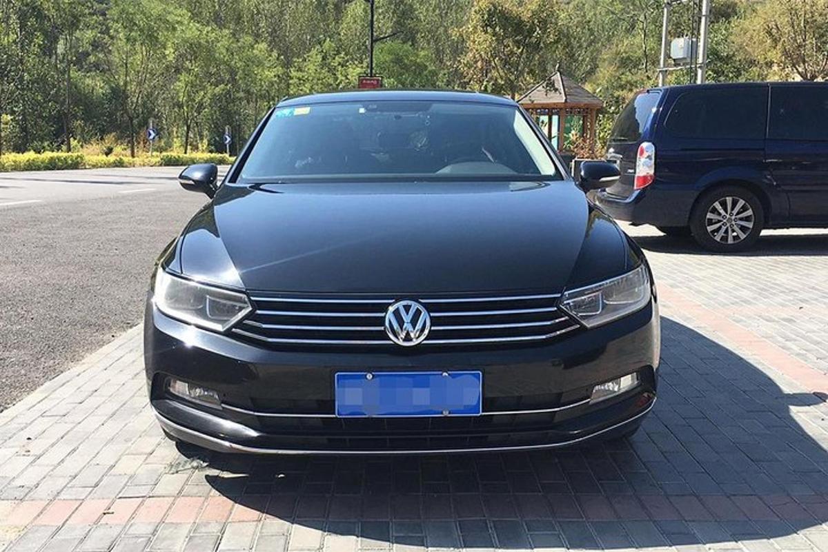 a black car parked in a parking lot