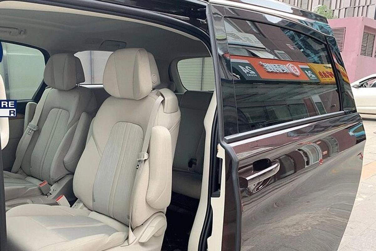 a back seat of a van with its doors open