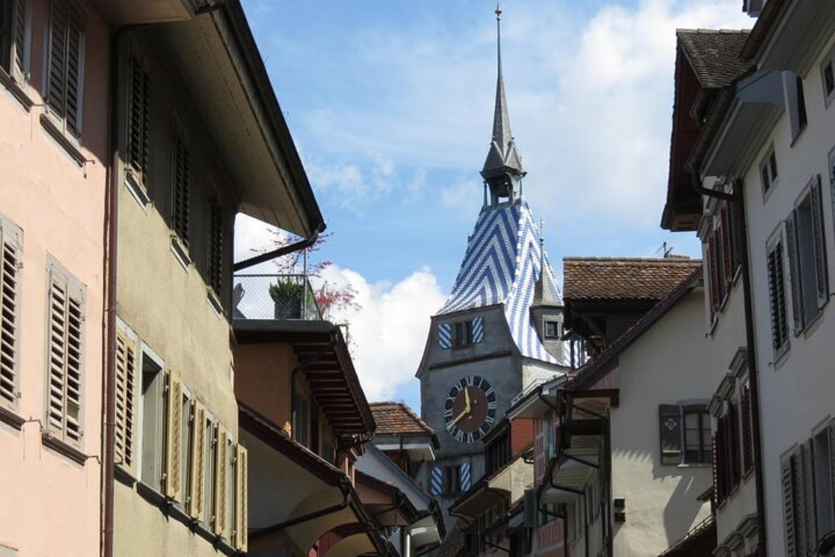 a clock tower in the middle of a street